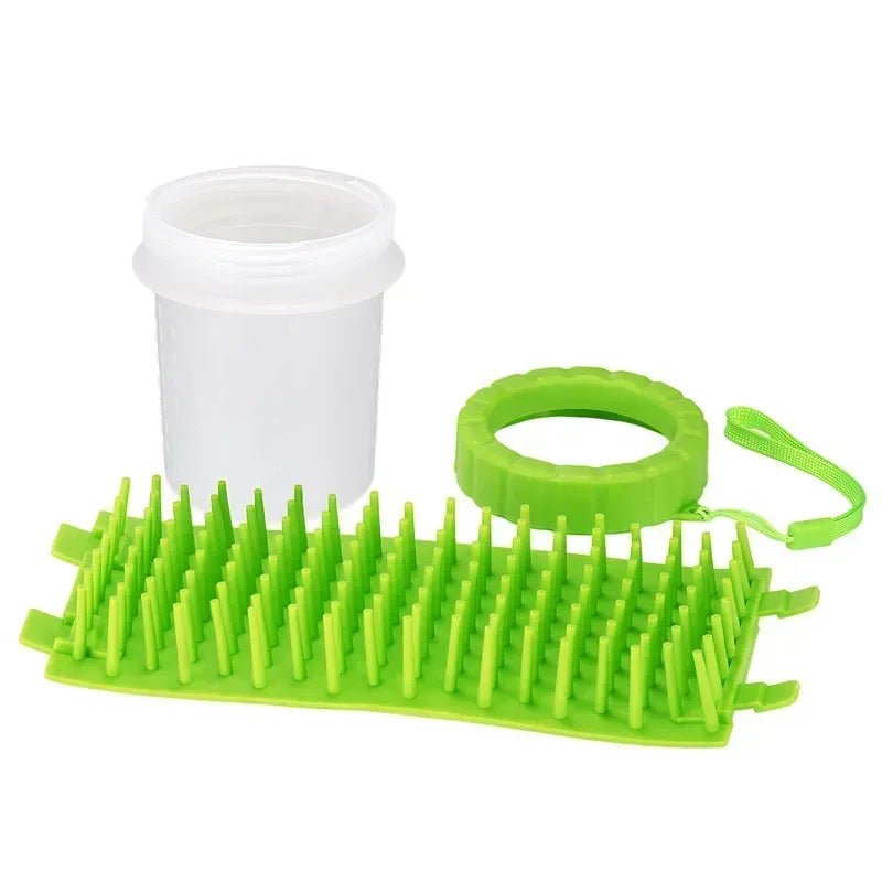 Green plastic scrubber with a white container and green handle on a white background